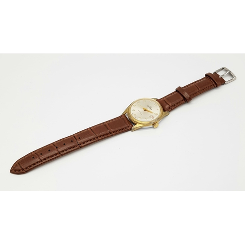 1003 - A Vintage Buler Deluxe Mechanical Gents Watch. Brown leathet strap. Two tone case - 34mm. Silver ton... 