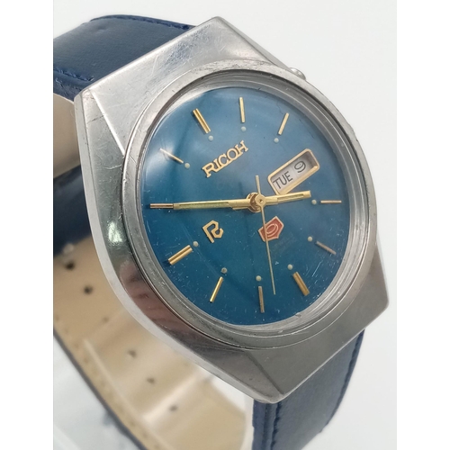 1230 - A Vintage 21 Jewel Ricoh Crystal 9 Gents Watch. Blue leather strap and stainless steel case - 37mm. ... 