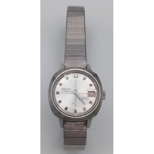 1242 - A Seiko 21 Jewel Hi-Beat Automatic Ladies Watch. Stainless steel strap and case - 23mm. Silver tone ... 