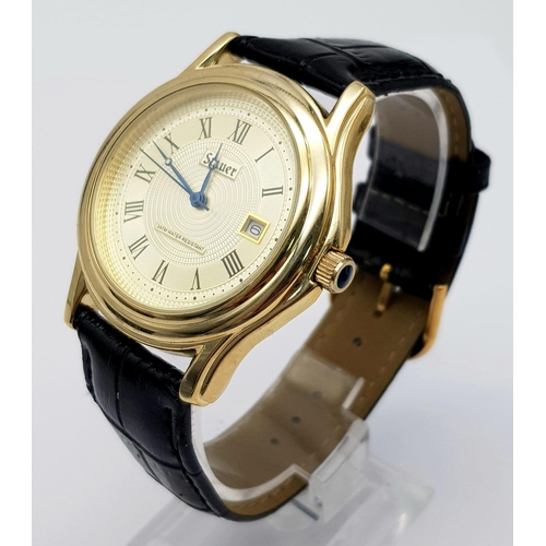 1340 - A Stauer Gents Dress Watch. Black leather strap. Two tone case - 40mm. Gold tone dial with date wind... 