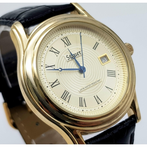 1340 - A Stauer Gents Dress Watch. Black leather strap. Two tone case - 40mm. Gold tone dial with date wind... 