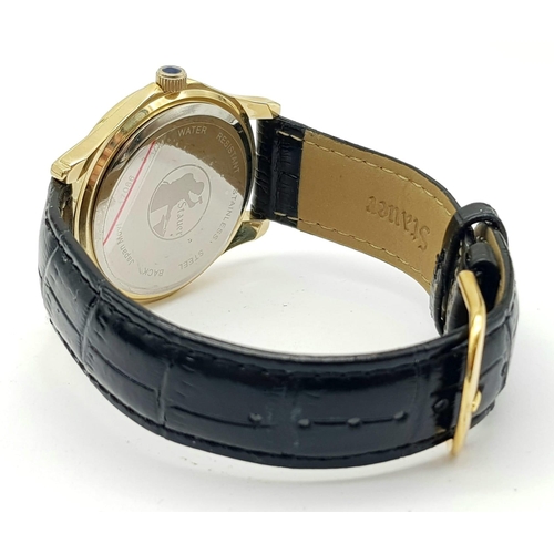 1340 - A Stauer Gents Dress Watch. Black leather strap. Two tone case - 40mm. Gold tone dial with date wind... 