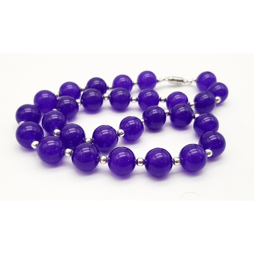 334 - A Purple Alexandrite Large Beaded Necklace. With silver tone spacers and magnetic clasp. 12mm beads.... 