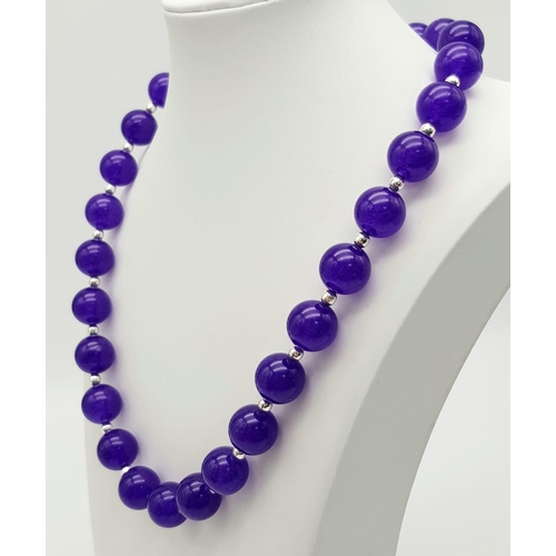 334 - A Purple Alexandrite Large Beaded Necklace. With silver tone spacers and magnetic clasp. 12mm beads.... 