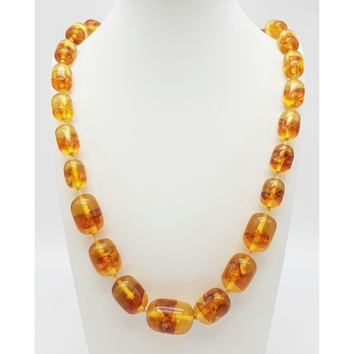 871 - INFUSED BROWN AMBER NECKLACE. WEIGHS 88G