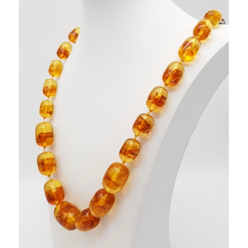 871 - INFUSED BROWN AMBER NECKLACE. WEIGHS 88G