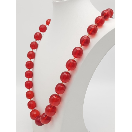 890 - RED AMBER NECKLACE. WEIGHS 105G