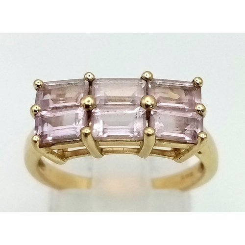 1016 - 9K YELLOW GOLD 6 PINK STONE RING. TOTAL WEIGHT 3G. SIZE N