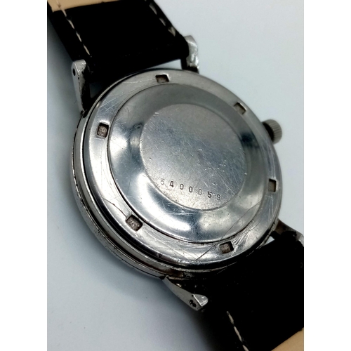 1406 - A Vintage Eterna-Matic 1000 Gents Watch. Black leather strap. Stainless steel case - 35mm. Silver to... 