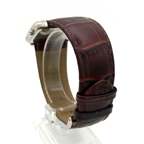 1441 - A Sekonda Dual Time Gents Watch. Brown leather strap. Stainless steel case - 40mm. Two tone dial wit... 