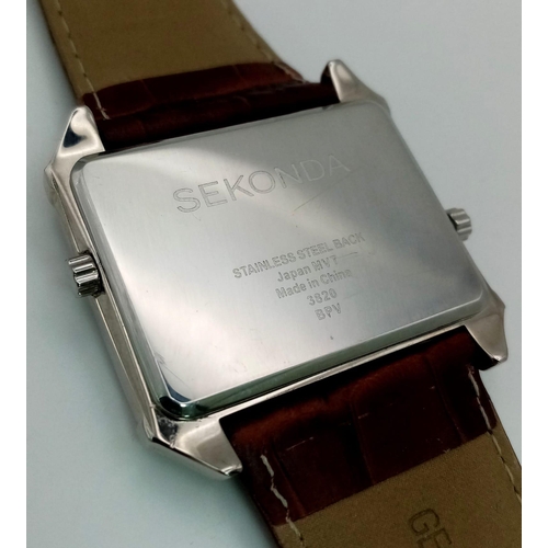 1441 - A Sekonda Dual Time Gents Watch. Brown leather strap. Stainless steel case - 40mm. Two tone dial wit... 