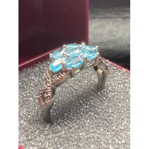 504 - Beautiful SILVER and BLUE TOPAZ RING having Topaz gemstones cluster set to top, with Silver and Diam... 