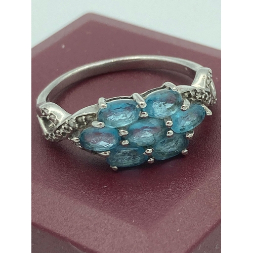 504 - Beautiful SILVER and BLUE TOPAZ RING having Topaz gemstones cluster set to top, with Silver and Diam... 