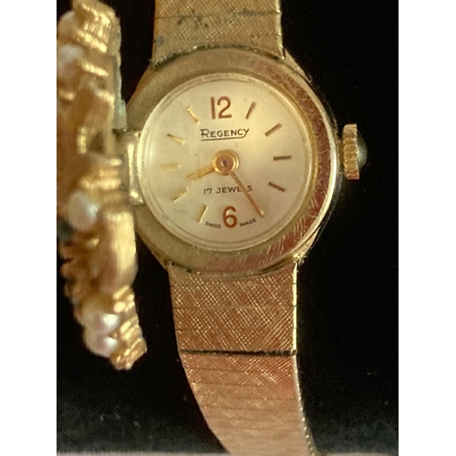 546 - Rare vintage REGENCY ladies flip top wristwatch in gold tone, having seed pearl and emerald quartz j... 