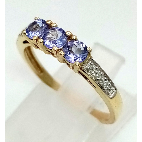 720 - 9K YELLOW GOLD DIAMOND & IOLITE RING. WEIGHS 1.8G.  SIZE P