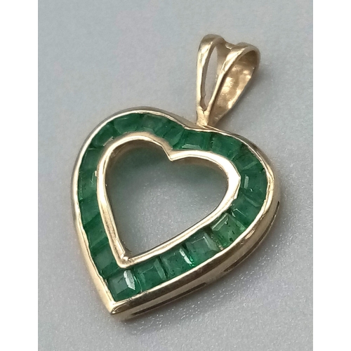 995 - 9K YELLOW GOLD EMERALD SET, OPEN HEART PENDANT. TOTAL WEIGHT 0.8G