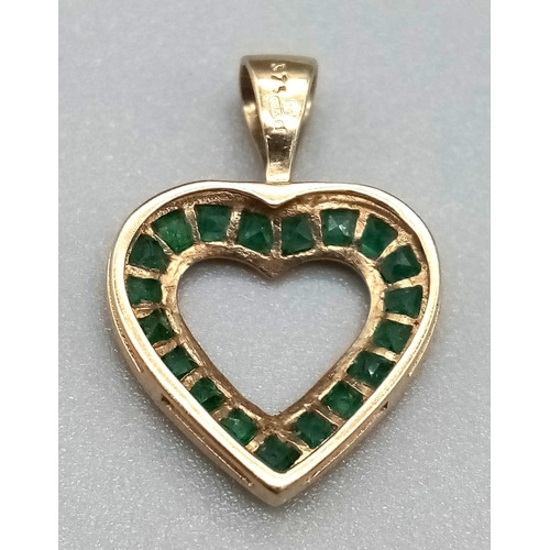 995 - 9K YELLOW GOLD EMERALD SET, OPEN HEART PENDANT. TOTAL WEIGHT 0.8G