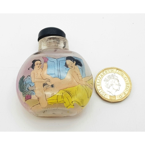 1378 - A 19th century Chinese crystal glass snuff bottle with inside painted erotic pictures to front and b... 