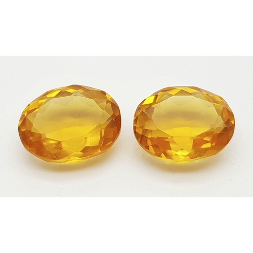 1076 - A Pair of 12ct (24ct) Orange/Cognac Coloured Faceted Oval Gemstones. 20 x 15mm. No visible marks. He... 