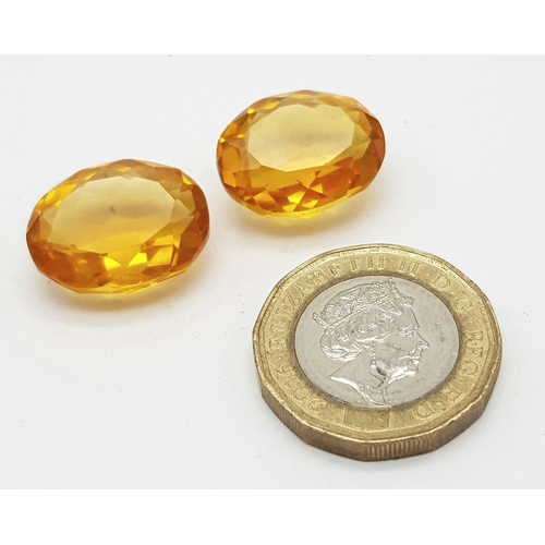 1076 - A Pair of 12ct (24ct) Orange/Cognac Coloured Faceted Oval Gemstones. 20 x 15mm. No visible marks. He... 