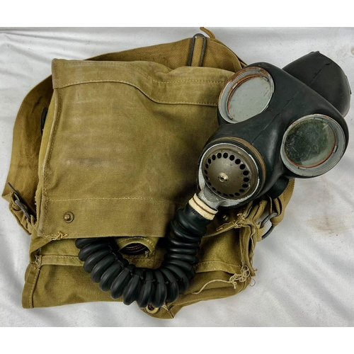 1244 - A Very Good Condition 1944 Dated Military Gas Mask in its Original Khaki Satchel with Anti Dimming T... 