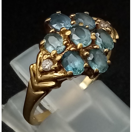 157 - 9K YELLOW GOLD, DIAMOND & TOPAZ FANCY CLUSTER RING. WEIGHS 3.1G.  SIZE M