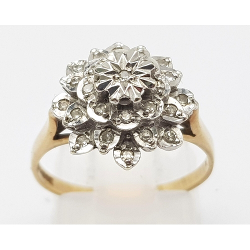 383 - 9K YELLOW GOLD DIAMOND SET CLUSTER RING. WEIGHS 3G.  SIZE O