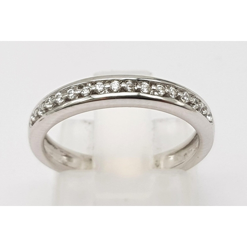 396 - 18K WHITE GOLD DIAMOND HALF ETERNITY RING.  0.10CT DIAMOND. TOTAL WEIGHT 2.8G.  SIZE K