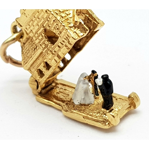 401 - 9K YELLOW GOLD CHURCH CHARM, THAT OPENS TO REVEAL A BRIDE AND GROOM AND A VICAR. WEIGHS 3.8G