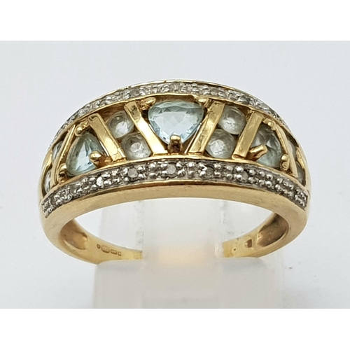 429 - 9K YELLOW GOLD DIAMOND & TOPAZ FANCY BAND RING. WEIGHS 4.1G. SIZE P