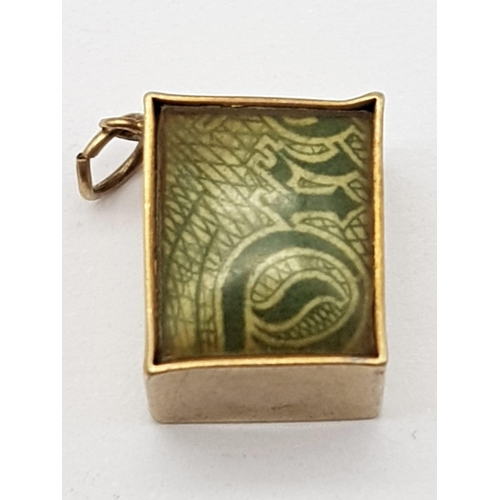 543 - 9K YELLOW GOLD, OLD ONE POUND NOTE CHARM. WEIGHS 3.4G