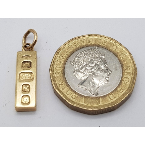 557 - 9K YELLOW GOLD SMALL INGOT CHARM / PENDANT. WEIGHS 3.1G