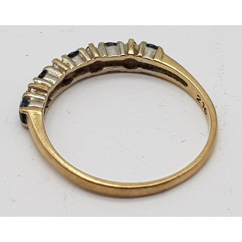 713 - 9K YELLOW GOLD DIAMOND & SAPPHIRE HALF ETERNITY RING. WEIGHS 1.4G. SIZE N