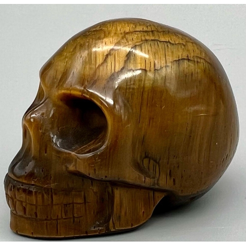 971 - A Tigers Eye Skull Figure. 6cm.