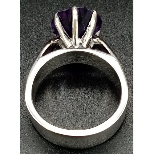 180 - A statement, 18K white gold ring with a large, brilliant cut amethyst. Ring size: T, weight: 16.3 g.