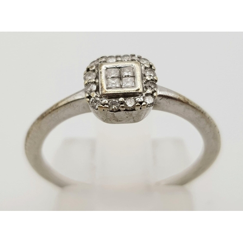 1023 - 9K WHITE GOLD DIAMOND SET CLUSTER RING.  0.15CT DIAMOND.TOTAL WEIGHT 2G.  SIZE L