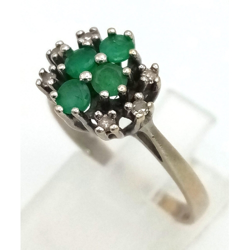 215 - 18K WHITE GOLD VINTAGE DIAMOND & EMERALD CLUSTER RING. WEIGHS 3.6G. SIZE P