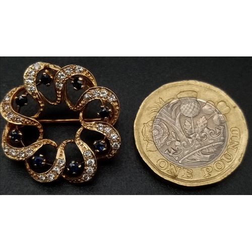 243 - 9K YELLOW GOLD DIAMOND & SAPPHIRE BROOCH, GORGEOUS CLEAN DIAMONDS. WEIGHS 4.6G