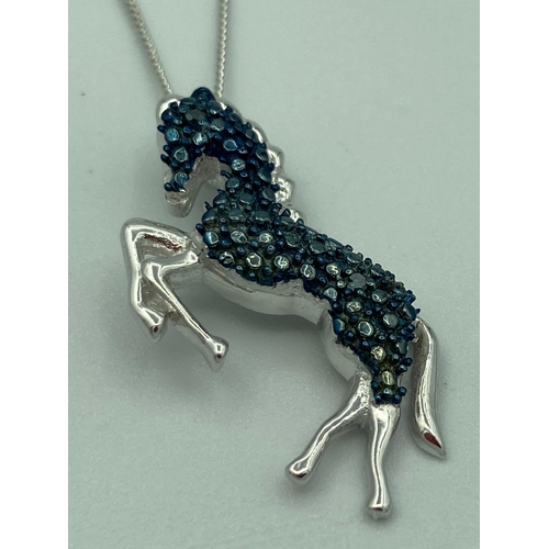 343 - BLUE DIAMOND set SILVER HORSE PENDANT  mounted on a fine silver chain. Pendant 2.75 cm. Silver chain... 