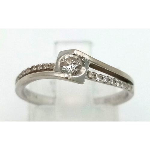 362 - 18K WHITE GOLD DIAMOND SOLITAIRE RING WITH TWIST DIAMOND SHOULDERS. 0.18CT DIAMOND. WEIGHS 2.2G. SIZ... 