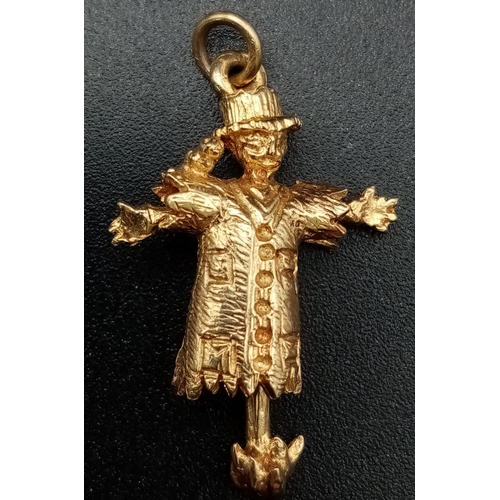 408 - 9K YELLOW GOLD SCARECROW WITH MOVING ARMS CHARM. WEIGHS 3.6G