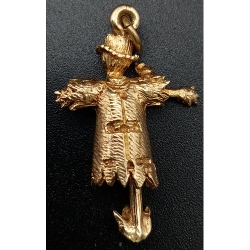 408 - 9K YELLOW GOLD SCARECROW WITH MOVING ARMS CHARM. WEIGHS 3.6G