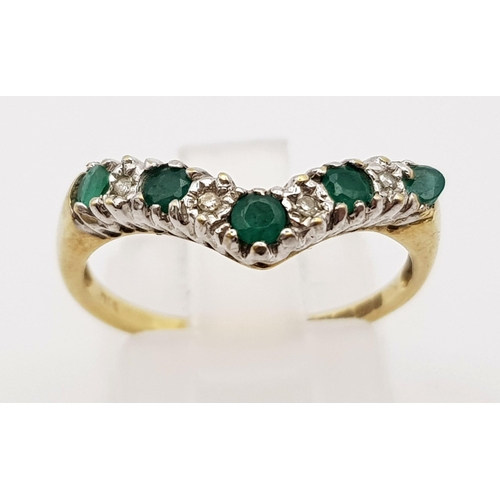 564 - 9K YELLOW GOLD DIAMOND & EMERALD WISHBONE RING. WEIGHS 2.2G.  SIZE O