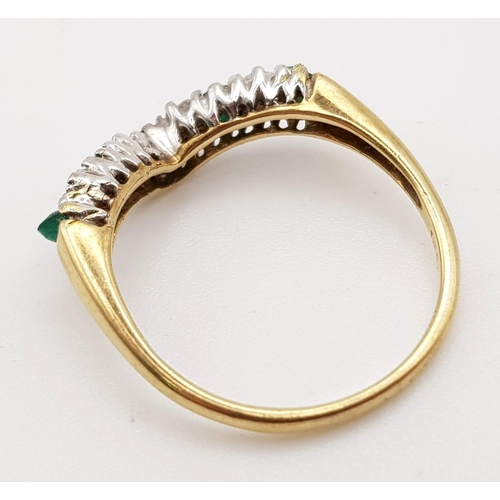 564 - 9K YELLOW GOLD DIAMOND & EMERALD WISHBONE RING. WEIGHS 2.2G.  SIZE O