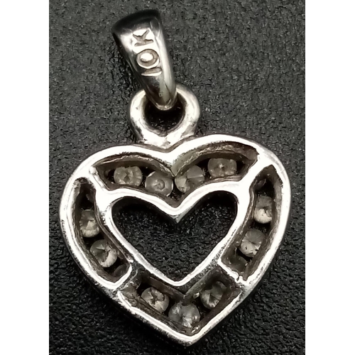 578 - 10K WHITE GOLD DIAMOND SET HEART PENDANT. WEIGHS 1.1G