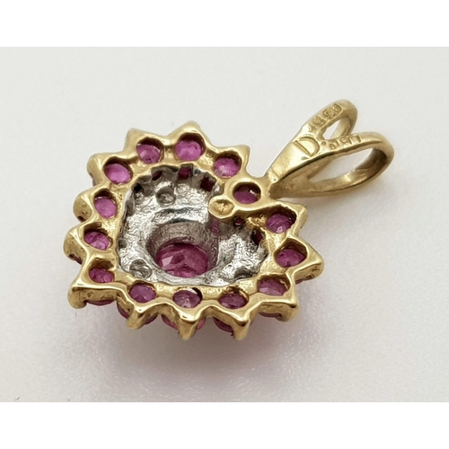 585 - 9K YELLOW GOLD DIAMOND & RUBY HEART PENDANT. WEIGHS 0.7G