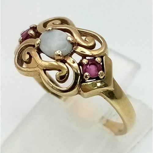 676 - 9K YELLOW GOLD RUBY & OPAL RING. WEIGHS 2.4G. SIZE Q