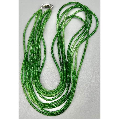 864 - GREEN GARNET FACETTED NECKLACE 5 ROW NECKLACE. TOTAL WEIGHT 40.4G