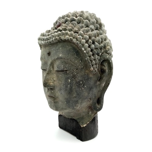 595 - AN EXTREMELY OLD ANTIQUE GEM SET HAND CARVED WOODEN BUDDHIST HEAD WITH FLAT BACK  25 X 13cms. a/f