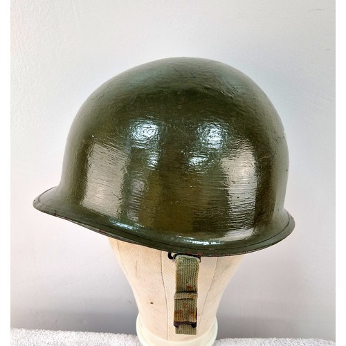 1019 - An Original Very Good Condition US 1940’s-1960’s Army Helmet, Repainted having been used by a re-ena... 